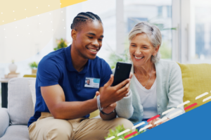 friendly male heathcare provider shows happy female patient information on cell phone